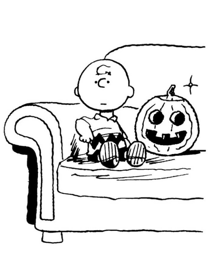 colorindo a página rapaz junto à abóbora do halloween