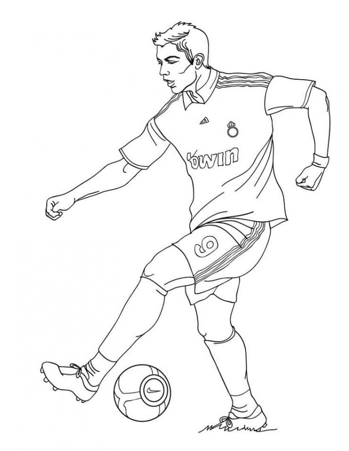 coloring page football player kicks the ball